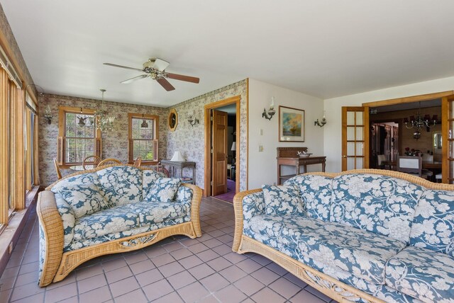 248 Morse Rd, Norway, ME 04268 - tiled living area featuring wallpapered walls, a ceiling fan, and a chandelier