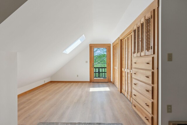 248 Morse Rd, Norway, ME 04268 - bonus room with light wood finished floors, a skylight, vaulted ceiling, and baseboards