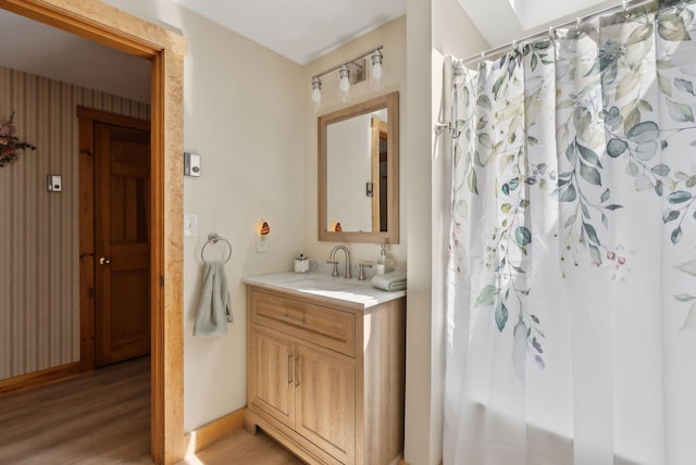 248 Morse Rd, Norway, ME 04268 - full bathroom featuring wood finished floors, vanity, and curtained shower
