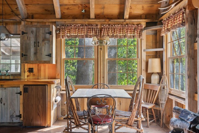 248 Morse Rd, Norway, ME 04268 - dining room with plenty of natural light, beam ceiling, and wood ceiling