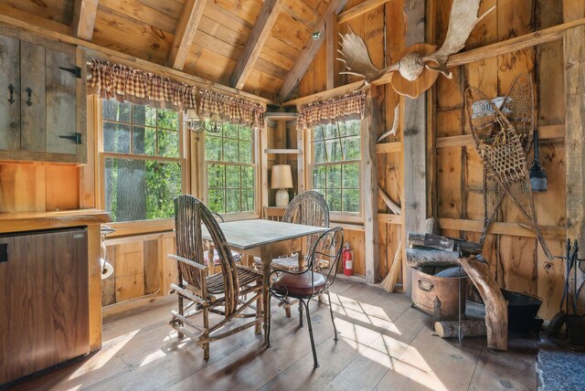 248 Morse Rd, Norway, ME 04268 - dining space with wooden ceiling, wooden walls, and wood finished floors