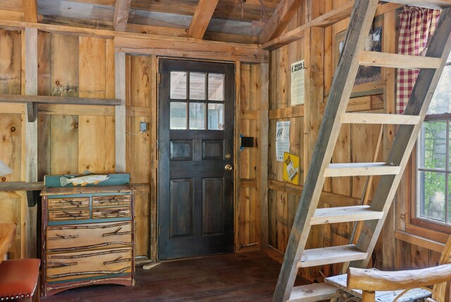 248 Morse Rd, Norway, ME 04268 - entrance foyer with wooden walls and dark wood-type flooring