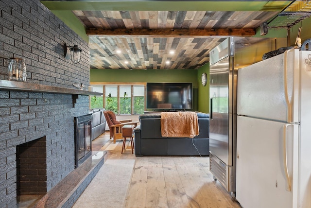 692 S St, Biddeford, ME 04005 - living room featuring a large fireplace, hardwood / wood-style flooring, and wood ceiling with exposed beams