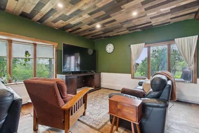 692 S St, Biddeford, ME 04005 - living area with wooden ceiling, a wainscoted wall, hardwood / wood-style floors, and recessed lighting