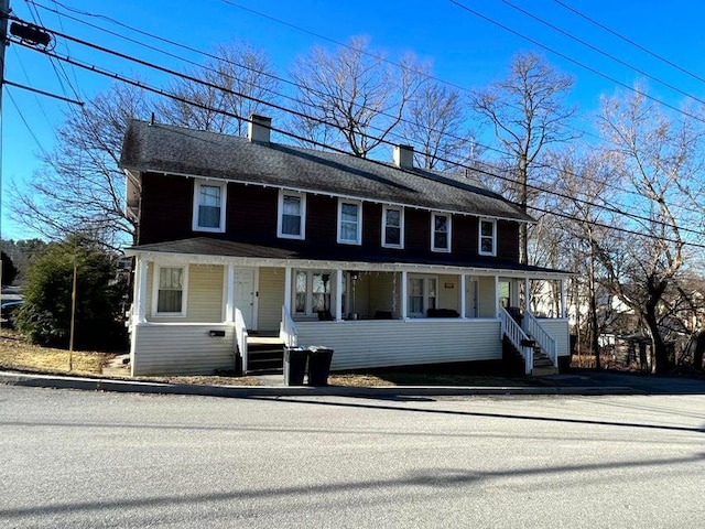 30 Patterson St, Augusta, ME 04330 - view of front facade featuring a porch and a chimney