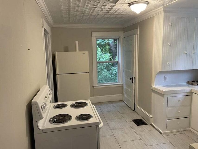 30 Patterson St, Augusta, ME 04330 - kitchen featuring white appliances, crown molding, white cabinetry, and baseboards