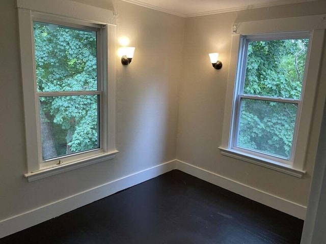 30 Patterson St, Augusta, ME 04330 - unfurnished room featuring baseboards, plenty of natural light, crown molding, and dark wood finished floors
