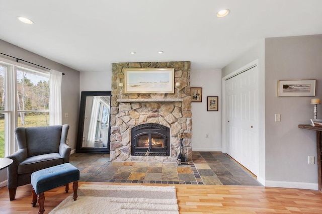 45AND57 Southgate Rd, Kennebunk, ME 04043 - living area featuring baseboards, a stone fireplace, recessed lighting, and wood finished floors