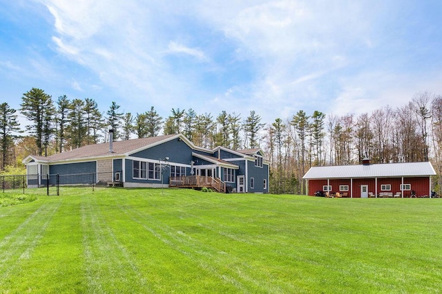 45AND57 Southgate Rd, Kennebunk, ME 04043 - back of house featuring an outdoor structure, a deck, a chimney, and a pole building