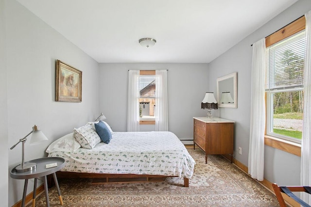 45AND57 Southgate Rd, Kennebunk, ME 04043 - bedroom with multiple windows, light wood-type flooring, baseboard heating, and baseboards
