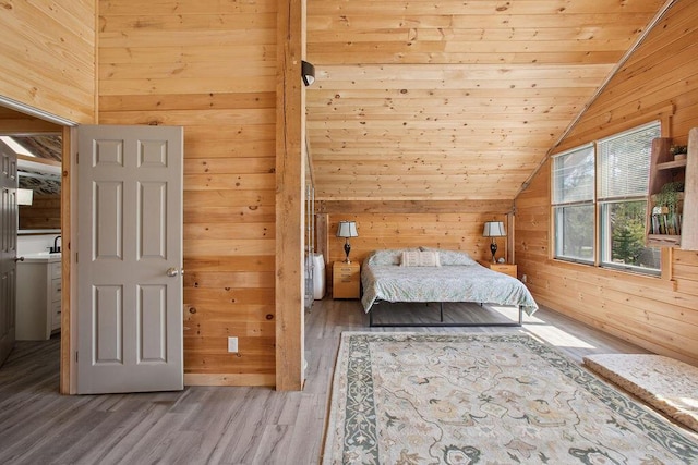 45AND57 Southgate Rd, Kennebunk, ME 04043 - bedroom featuring lofted ceiling, wooden walls, wood finished floors, and wood ceiling