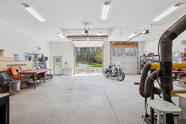 45AND57 Southgate Rd, Kennebunk, ME 04043 - garage featuring a workshop area and a garage door opener