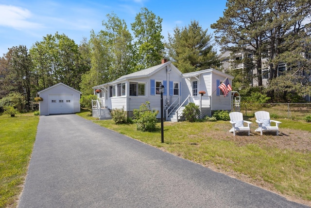 19 Fairhaven Ave, Saco, ME 04072 - view of front of property with an outdoor structure, a garage, a chimney, and driveway