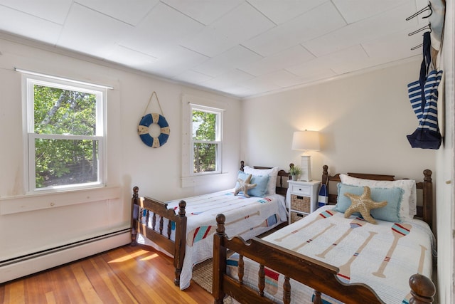 19 Fairhaven Ave, Saco, ME 04072 - bedroom featuring a baseboard heating unit and light wood finished floors