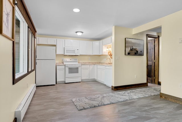 10 E Pinnacle Rd Unit 10, Bridgton, ME 04009 - kitchen with white appliances, baseboard heating, baseboards, white cabinetry, and recessed lighting