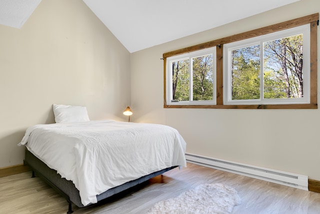 10 E Pinnacle Rd Unit 10, Bridgton, ME 04009 - bedroom with baseboard heating, lofted ceiling, wood finished floors, and baseboards