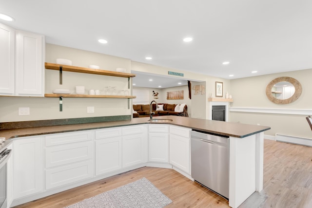 10 E Pinnacle Rd Unit 10, Bridgton, ME 04009 - kitchen with stainless steel dishwasher, a sink, light wood-style floors, dark countertops, and recessed lighting