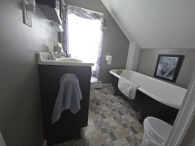 6 Linden St, Waterville, ME 04901 - full bathroom with toilet, lofted ceiling, a freestanding bath, and vanity
