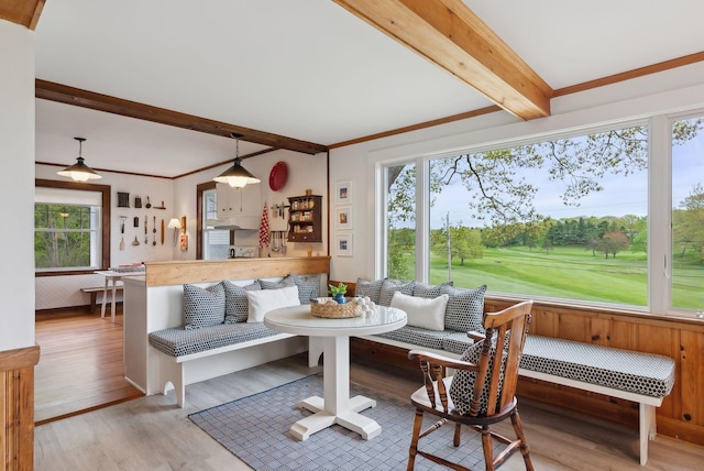 14 Oak St, Kennebunk, ME 04043 - living area with beam ceiling, breakfast area, wood finished floors, and crown molding