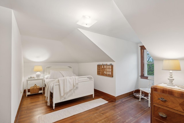 14 Oak St, Kennebunk, ME 04043 - bedroom with lofted ceiling, dark wood finished floors, and baseboards