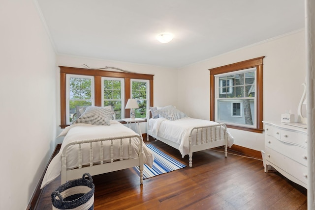 14 Oak St, Kennebunk, ME 04043 - bedroom featuring dark wood-style flooring, ornamental molding, and baseboards