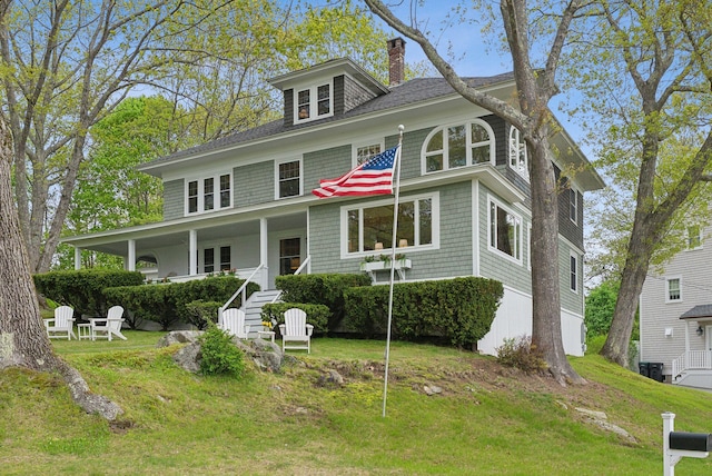 14 Oak St, Kennebunk, ME 04043 - traditional style home with a chimney, a front lawn, and roof with shingles