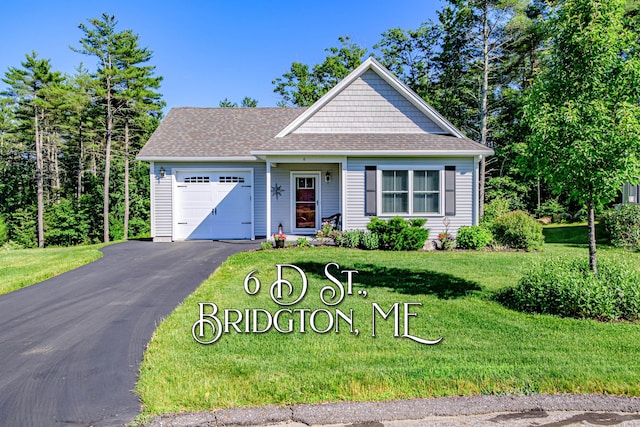 6 D St, Bridgton, ME 04009 - view of front of home with an attached garage, asphalt driveway, a front lawn, and a shingled roof