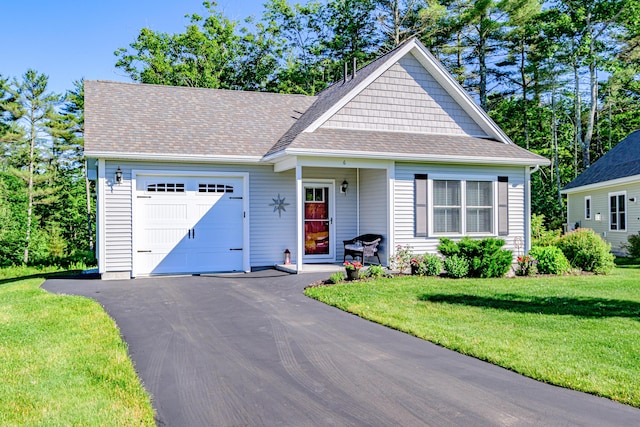6 D St, Bridgton, ME 04009 - view of front of property featuring a garage, a front yard, asphalt driveway, and roof with shingles