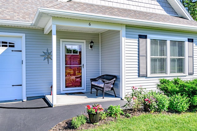 6 D St, Bridgton, ME 04009 - property entrance featuring roof with shingles and covered porch