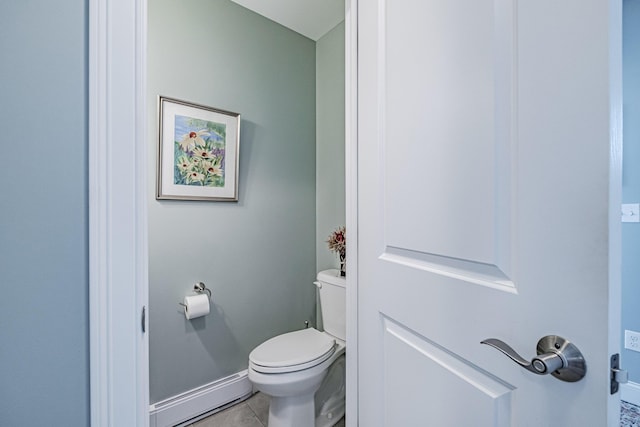 6 D St, Bridgton, ME 04009 - bathroom featuring baseboard heating, toilet, tile patterned floors, and baseboards