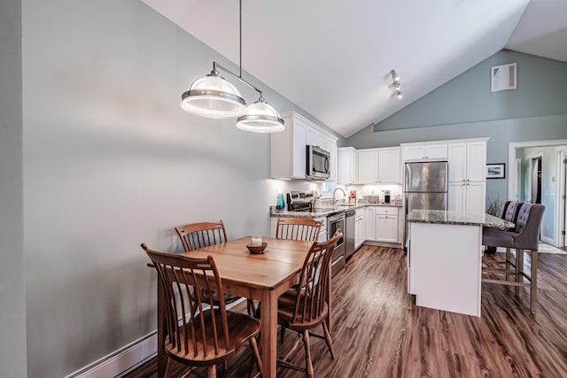 6 D St, Bridgton, ME 04009 - dining space featuring high vaulted ceiling and dark wood-type flooring