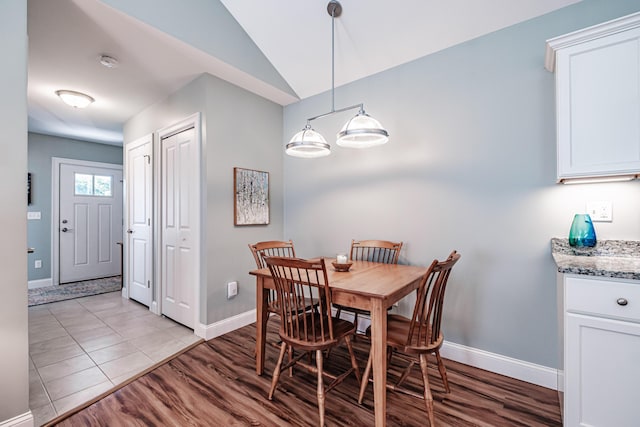 6 D St, Bridgton, ME 04009 - dining area featuring baseboards, light wood finished floors, and lofted ceiling