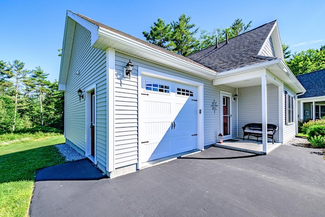 6 D St, Bridgton, ME 04009 - view of side of property featuring a shingled roof, a garage, and a yard