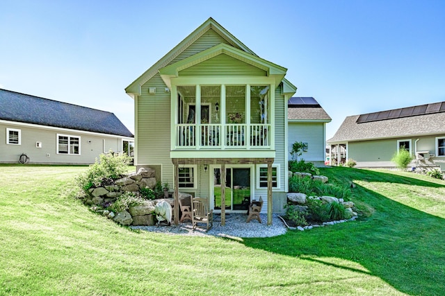 6 D St, Bridgton, ME 04009 - back of house featuring a yard, a sunroom, and a patio