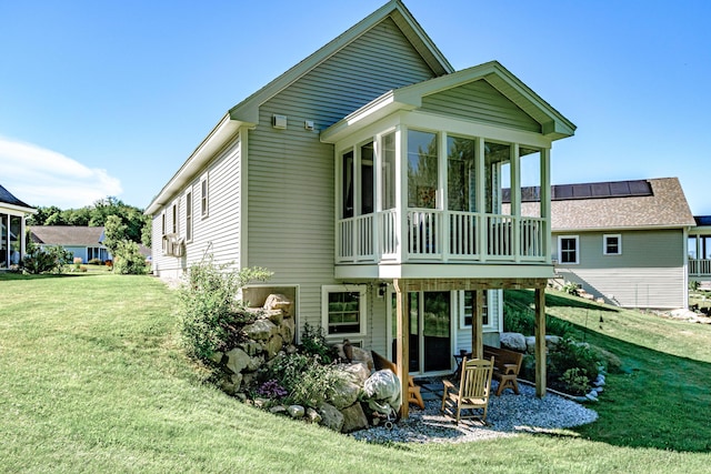 6 D St, Bridgton, ME 04009 - rear view of house featuring a sunroom, a yard, and a patio area