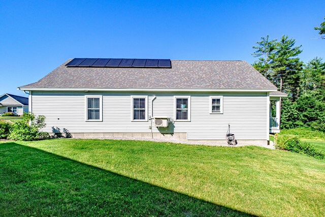 6 D St, Bridgton, ME 04009 - rear view of property featuring solar panels, a lawn, and a shingled roof