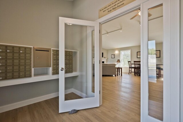 6 D St, Bridgton, ME 04009 - interior space with mail area, wood finished floors, track lighting, and baseboards