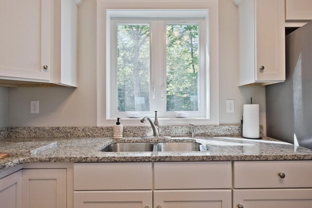 6 D St, Bridgton, ME 04009 - kitchen with a sink, white cabinets, and light stone countertops