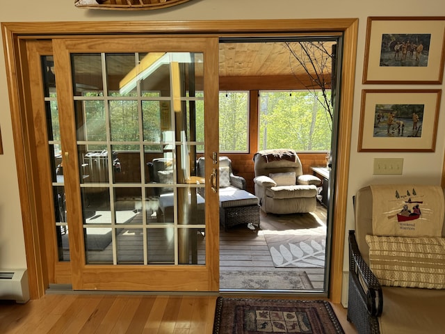 11 Cherry Dr, Embden, ME 04958 - doorway to outside featuring wood-type flooring and baseboard heating