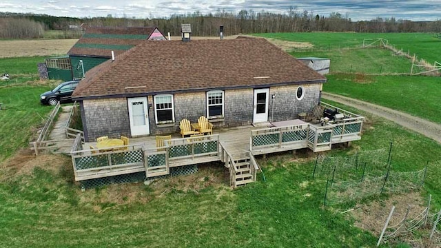 899 Golden Ridge Rd, Sherman, ME 04476 - rear view of house with a wooden deck, a lawn, and stone siding