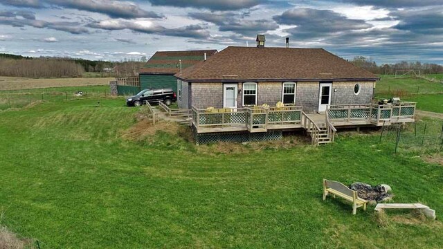 899 Golden Ridge Rd, Sherman, ME 04476 - rear view of property with a lawn and a deck