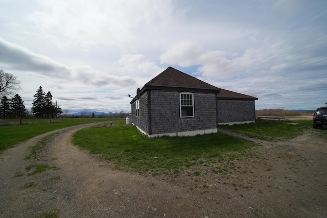 899 Golden Ridge Rd, Sherman, ME 04476 - view of property exterior with driveway and a shingled roof