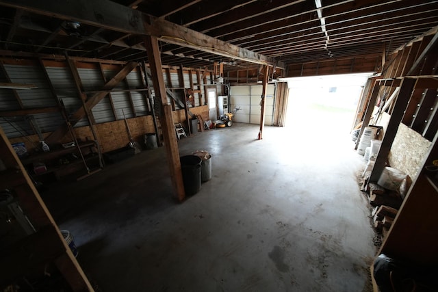 899 Golden Ridge Rd, Sherman, ME 04476 - misc room featuring unfinished concrete flooring and gas water heater