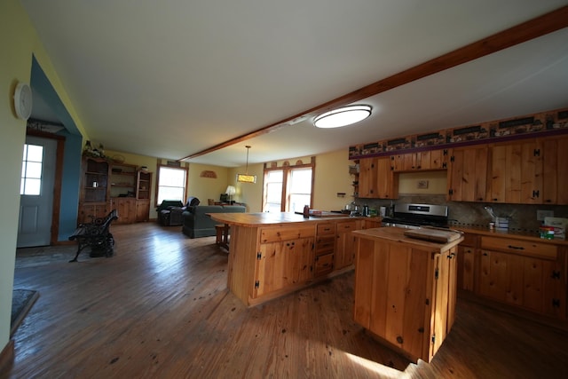 899 Golden Ridge Rd, Sherman, ME 04476 - kitchen featuring stainless steel range with electric stovetop, a peninsula, wood counters, and dark wood-style flooring