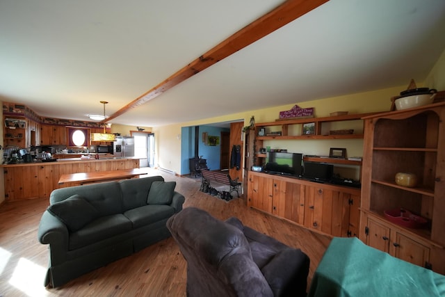 899 Golden Ridge Rd, Sherman, ME 04476 - living area with wood finished floors and beamed ceiling