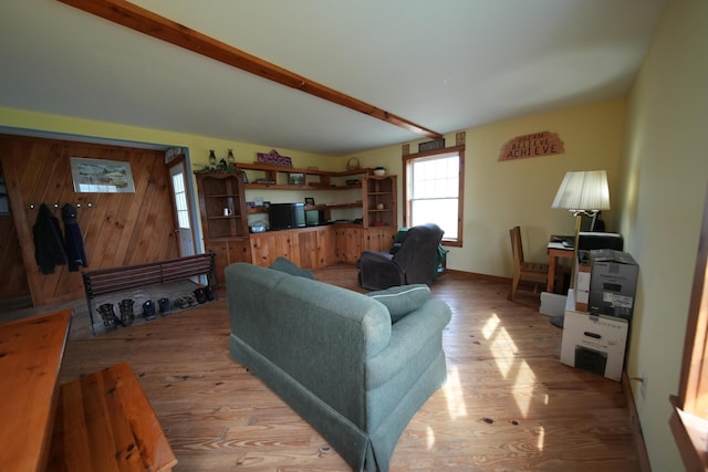 899 Golden Ridge Rd, Sherman, ME 04476 - living room featuring light wood-style floors and beam ceiling