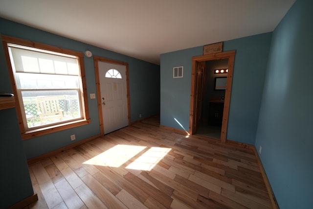 899 Golden Ridge Rd, Sherman, ME 04476 - entryway featuring wood finished floors and baseboards