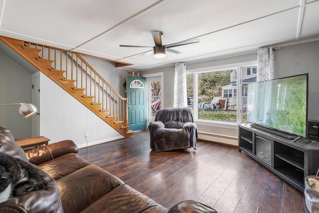 31 King St, Waterville, ME 04901 - living area with stairs, baseboard heating, a ceiling fan, hardwood / wood-style flooring, and baseboards