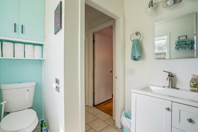 31 King St, Waterville, ME 04901 - bathroom featuring toilet, vanity, and tile patterned floors