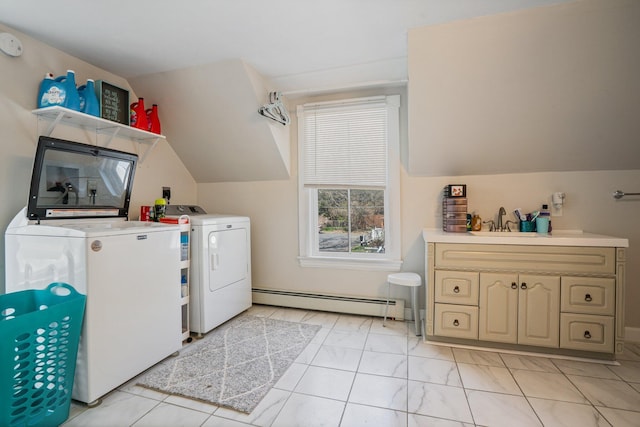 31 King St, Waterville, ME 04901 - washroom with a baseboard heating unit, washing machine and clothes dryer, and cabinet space